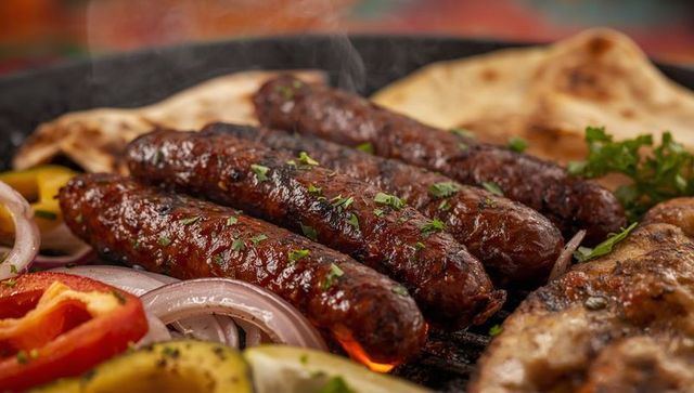 Grilled Sizzling Meat Kebabs with Vegetables and Flatbread