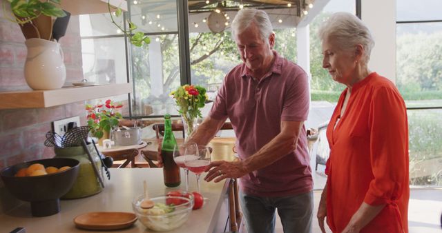 Elderly Couple Enjoying Time Together in Modern Kitchen - Download Free Stock Images Pikwizard.com