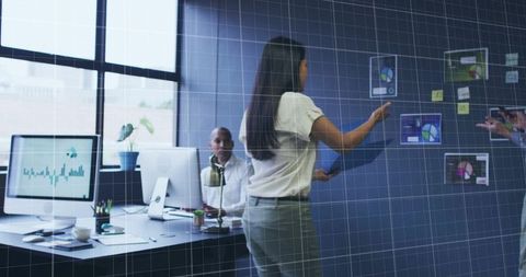 Woman Presenting Analytics in Modern Office Setting