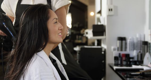 Woman at Salon Receiving Hair Treatment - Download Free Stock Images Pikwizard.com