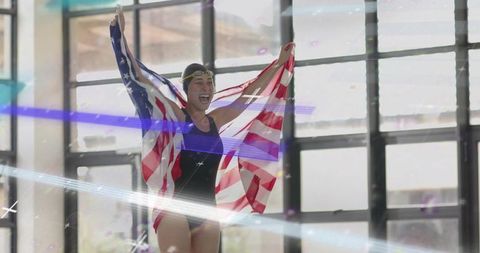 Triumphant Swimmer Celebrates Victory with American Flag