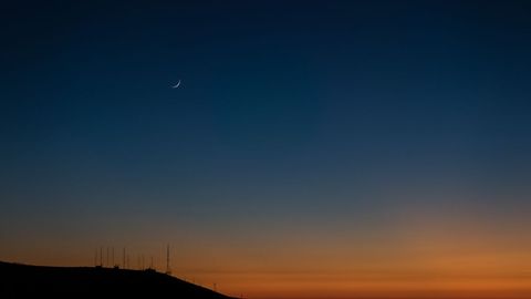 Crescent Moon Over Serene Evening Landscape with Radio Towers - Download Free Stock Images Pikwizard.com