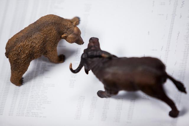 Miniature Bear and Buffalo on Financial Document - Download Free Stock Photos Pikwizard.com