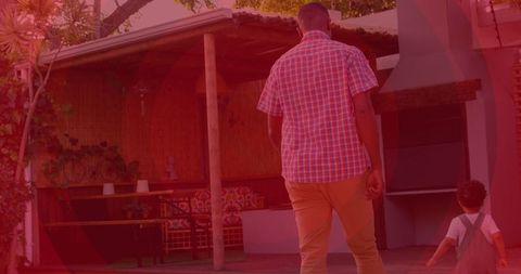 Father and Son Walking Outside During Heart Month Celebration