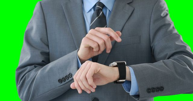 Businessman Checking Time on His Wristwatch in Formal Suit - Download Free Stock Images Pikwizard.com