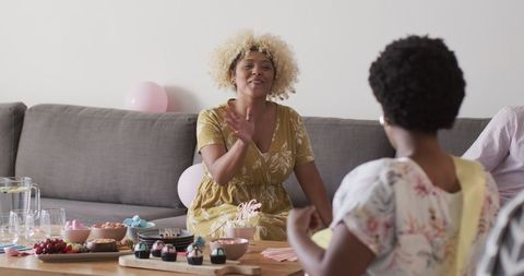 Lively celebration with food and balloons at home gathering