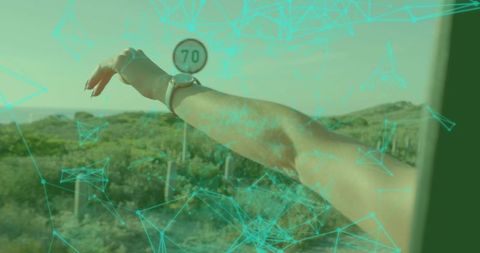 Hand reaches out car window with digital network effect