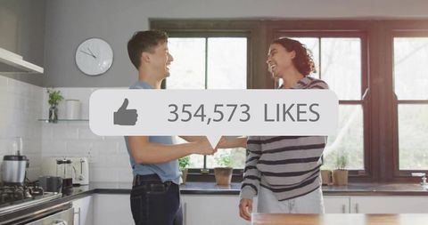 Young friends celebrating social media success in bright kitchen with huge likes overlay