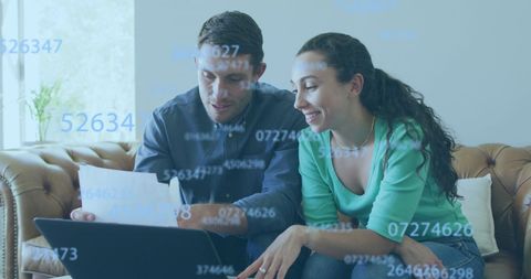 Caucasian Couple Analyzing Data on Laptop