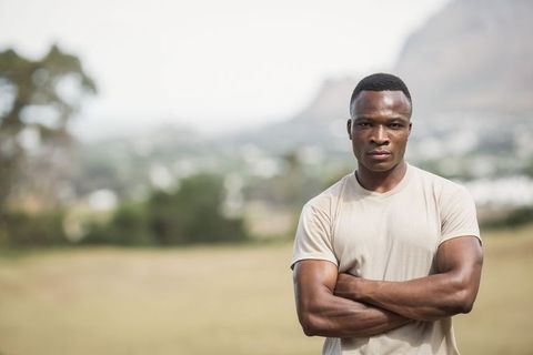 Confident African American Man Posing Outdoors on Open Field - Download Free Stock Images Pikwizard.com