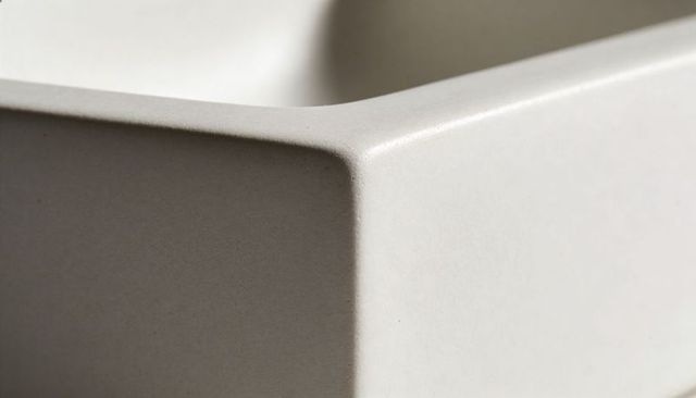 Showing matte beige ceramic container corner close-up minimalist design neutral texture