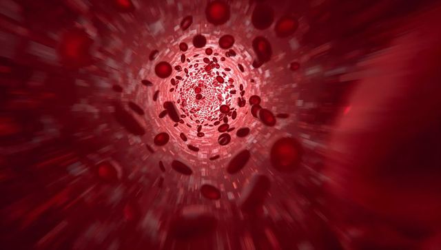 Flowing red blood cells racing through microscopic vessel toward glowing core, medical render