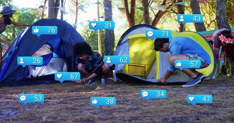 Group of Friends Camping and Pitching Tents in Forest