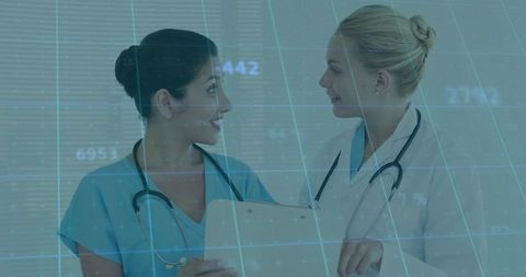 Healthcare Professionals Analyzing Data Innovation in Hospital Corridor