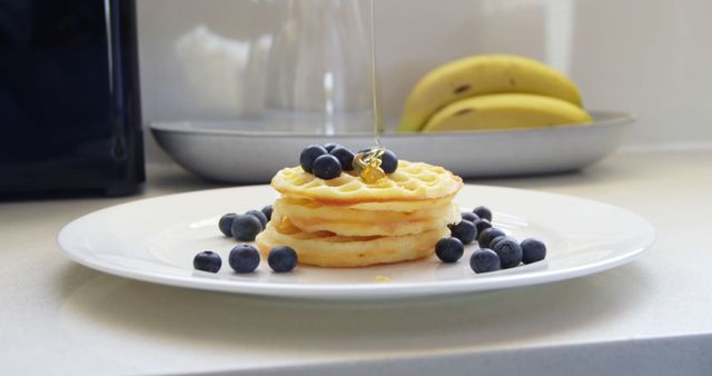 Stack of waffles with fresh blueberries and honey - Download Free Stock Images Pikwizard.com