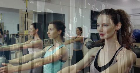 Women Exercising with Medicine Balls and Data Overlay for Fitness Analytics