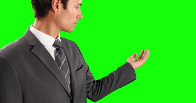 Businessman Gesturing with Hand on Isolated Green Screen - Download Free Stock Images Pikwizard.com