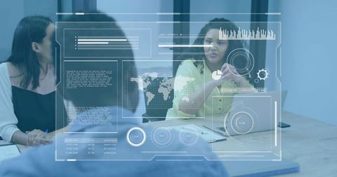 Female presenter gesturing during team meeting with digital dashboard overlay