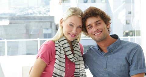 Cheerful Colleagues Posing in Bright Creative Space