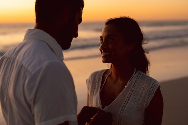 Romantic couple at sunset beach - Download Free Stock Photos Pikwizard.com