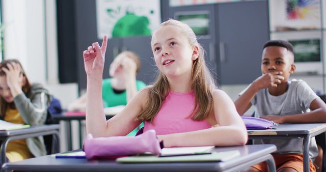 Eager Schoolgirl Raising Hand in Classroom Interaction - Download Free Stock Images Pikwizard.com