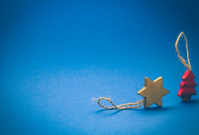 Rustic Star and Christmas Tree Decorations on Blue Background - Download Free Stock Photos Pikwizard.com