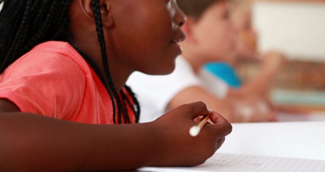 Focused Children Writing in Classroom with Multiracial Students Learning Together - Download Free Stock Images Pikwizard.com