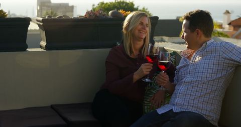 Happy Couple Enjoying Red Wine Sunset on Balcony - Download Free Stock Images Pikwizard.com