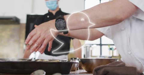 Chefs Collaborating in Commercial Kitchen with Modern Tools