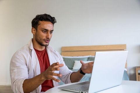 Man Expressing Ideas during Virtual Meeting at Home