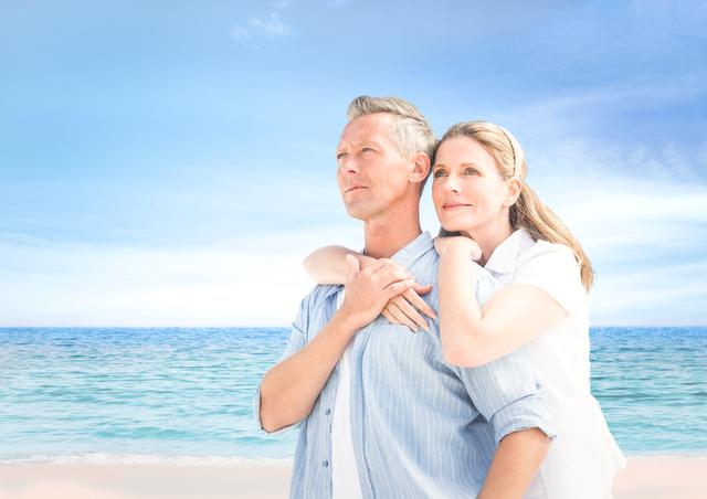 Digital composite of Couple looking to the horizon in the beach