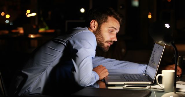 Businessman Working Late at Night in Office with Laptop - Download Free Stock Images Pikwizard.com