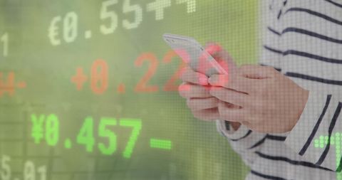 Business woman analyzing stock data on smartphone