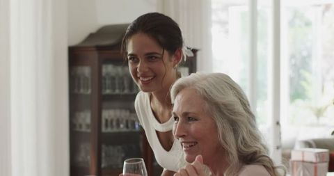 Guests enjoying conversation at elegant indoor celebration
