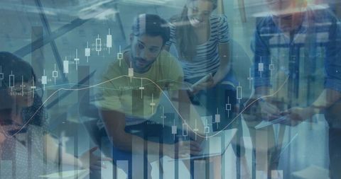 Young professionals collaborating on financial analytics with laptop and candlestick charts