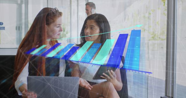 Two Businesswomen Discussing Data with Graph Overlay - Download Free Stock Images Pikwizard.com