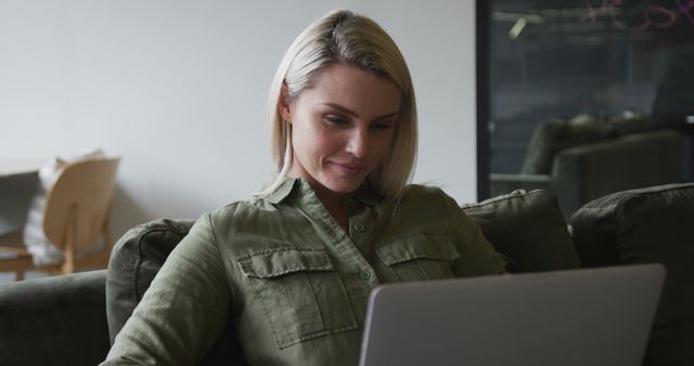 Blonde Woman Working on Laptop in Modern Office - Download Free Stock Images Pikwizard.com