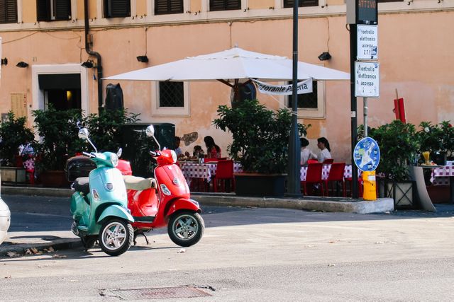 Colorful Scooters Parked in Front of Italian Restaurant - Download Free Stock Images Pikwizard.com