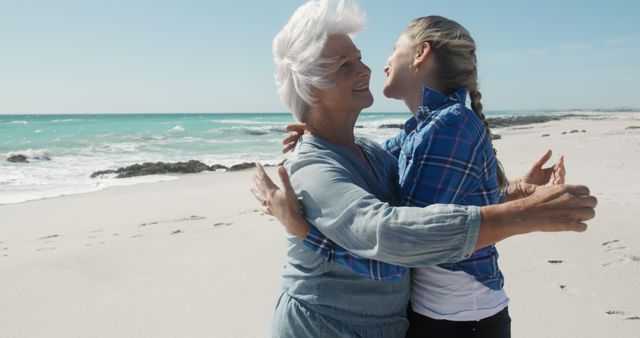 Happy caucasian senior woman hugging adult daughter on beach by sea, copy space - Download Free Stock Photos Pikwizard.com