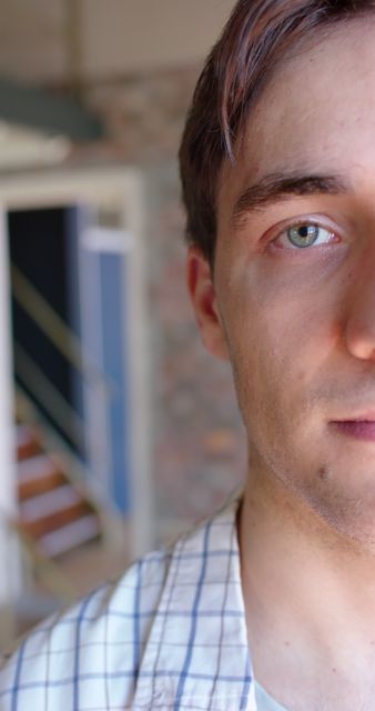 Serious Young Man Half-Face Close-Up with Blurred Background - Download Free Stock Images Pikwizard.com