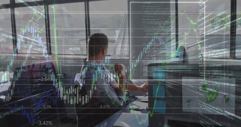 Businessman Analyzing Financial Data Trends in Office Environment