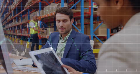 Warehouse Team Analyzing Financial Data with Digital Technology