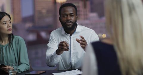 Diverse team meeting in contemporary office setting