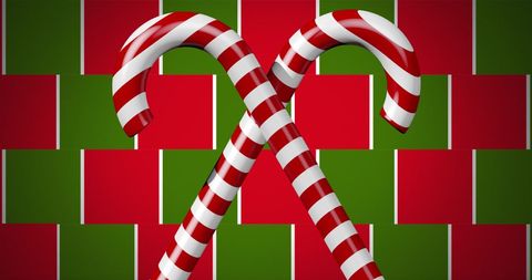 Festive Candy Canes on Red and Green Holiday Background
