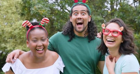 Diverse Friends Sharing Joy with Festive Headbands Outdoors