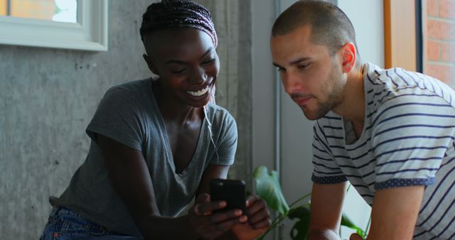 Friends Enjoying And Smiling While Looking At Smartphone - Download Free Stock Images Pikwizard.com