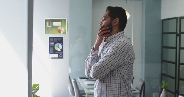 Business Professional Pensive in Office Analyzing Charts and Data - Download Free Stock Images Pikwizard.com