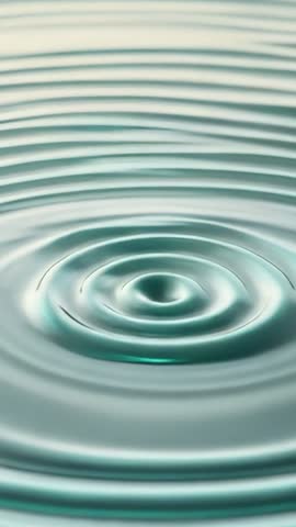 Vertical slow-motion concentric water ripples expanding from droplet impact