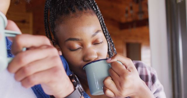 Woman Enjoying Hot Beverage Indoors with Eyes Closed - Download Free Stock Images Pikwizard.com