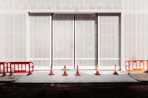 Modern urban construction scene with traffic cones and barriers